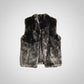Fabulous Furs brand dark gray and black faux fur vest.