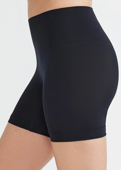 black high-waisted compression shorts.