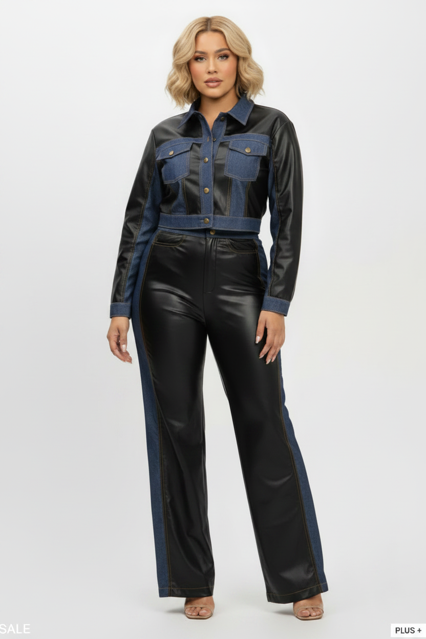 A model wearing a two-piece outfit consisting of a cropped long-sleeve shirt and wide-leg pants. The top is made of a mix of black faux leather and blue denim, while the pants are black faux leather with blue denim side panels.